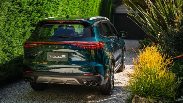 Chery Tiggo 8 Pro Max rear three-quarter in a garden driveway