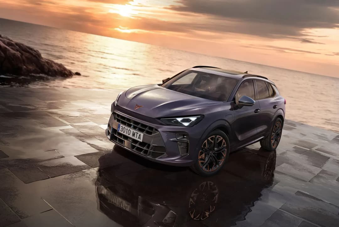 Cupra Terramar, front three-quarter on a wet seaside terrace at sunset