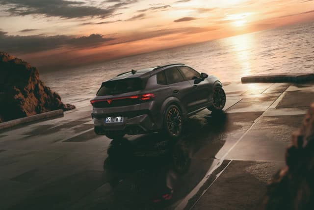 Cupra Terramar, rear three-quarter overlooking the sea at sunset
