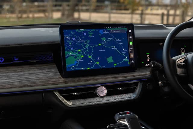 GWM Cannon Alpha dashboard with central touchscreen and woodgrain trim