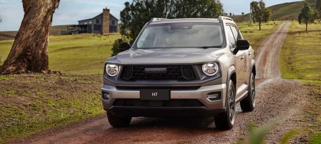 All new GWM Haval H7 front view on a dirt farm track