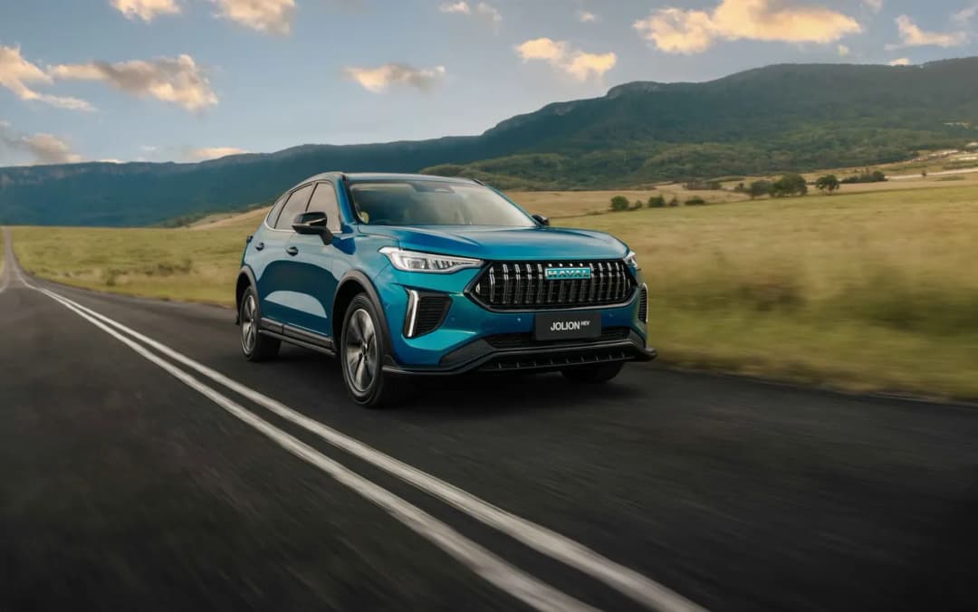 2026 GWM Haval Jolion in Aurora Green front three-quarter driving on a country road