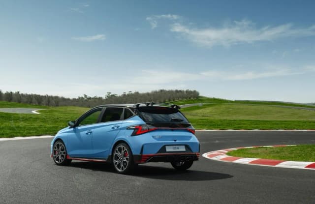 Hyundai i20 N rear three quarter on a race circuit