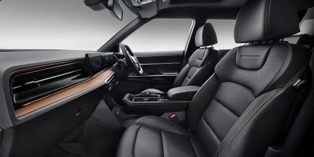 KGM Musso EV front cabin with leather seats and dashboard