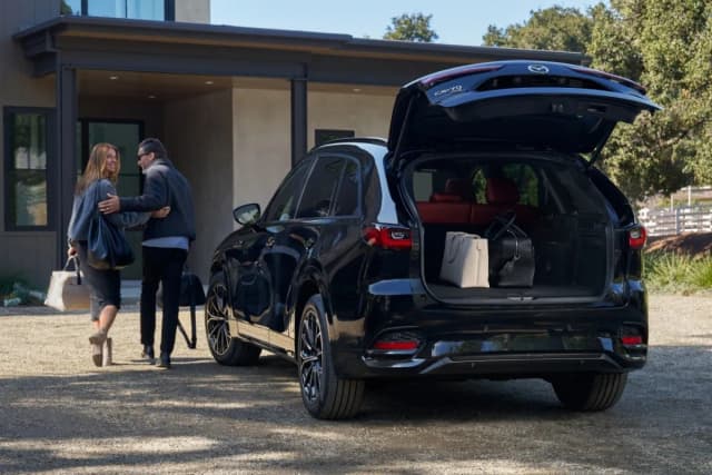 Mazda CX-70 with tailgate open and luggage in the cargo area