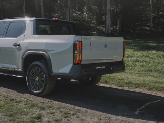MGU9 ute in silver rear three-quarter on a bush track