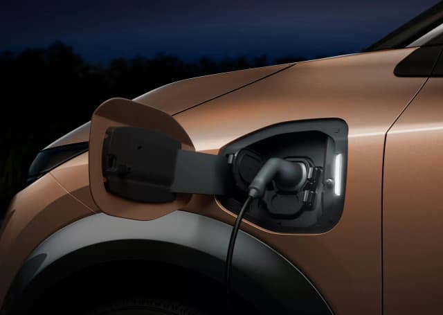 Nissan Ariya charging port with cable connected