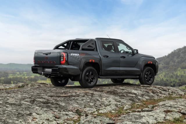 2026 Nissan Navara Pro-4X rear three-quarter on a rocky outcrop