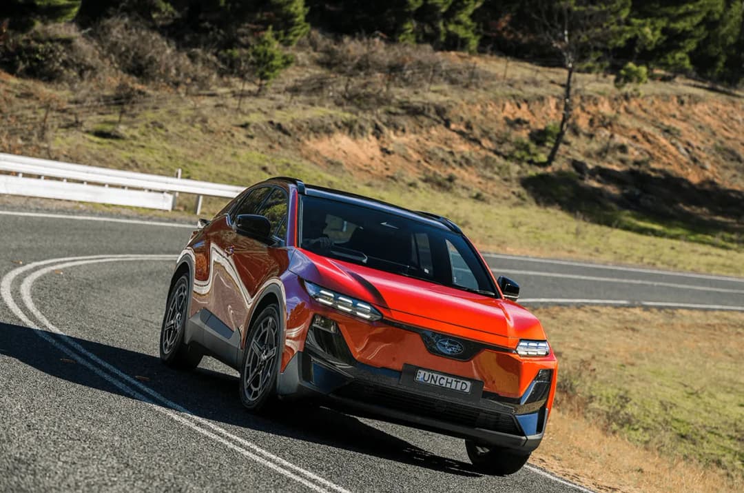 2026 Subaru Uncharted front three-quarter on a winding hill road