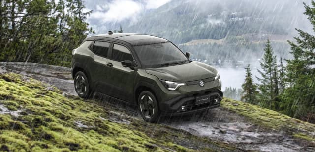 Suzuki e Vitara parked on a mossy hillside