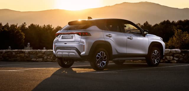Suzuki Fronx Hybrid rear three-quarter at sunset