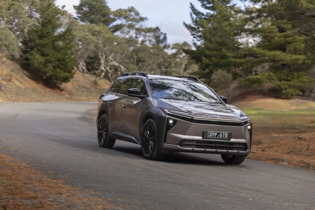 2026 Toyota bZ4X Touring driving on a forest road