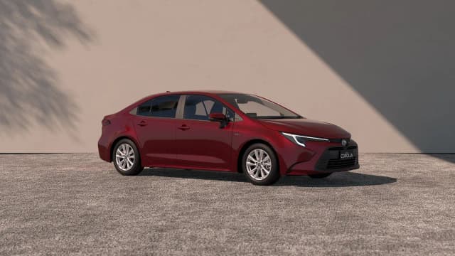 Toyota Corolla sedan hybrid in red, side profile