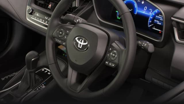 Toyota Corolla sedan steering wheel and digital instruments