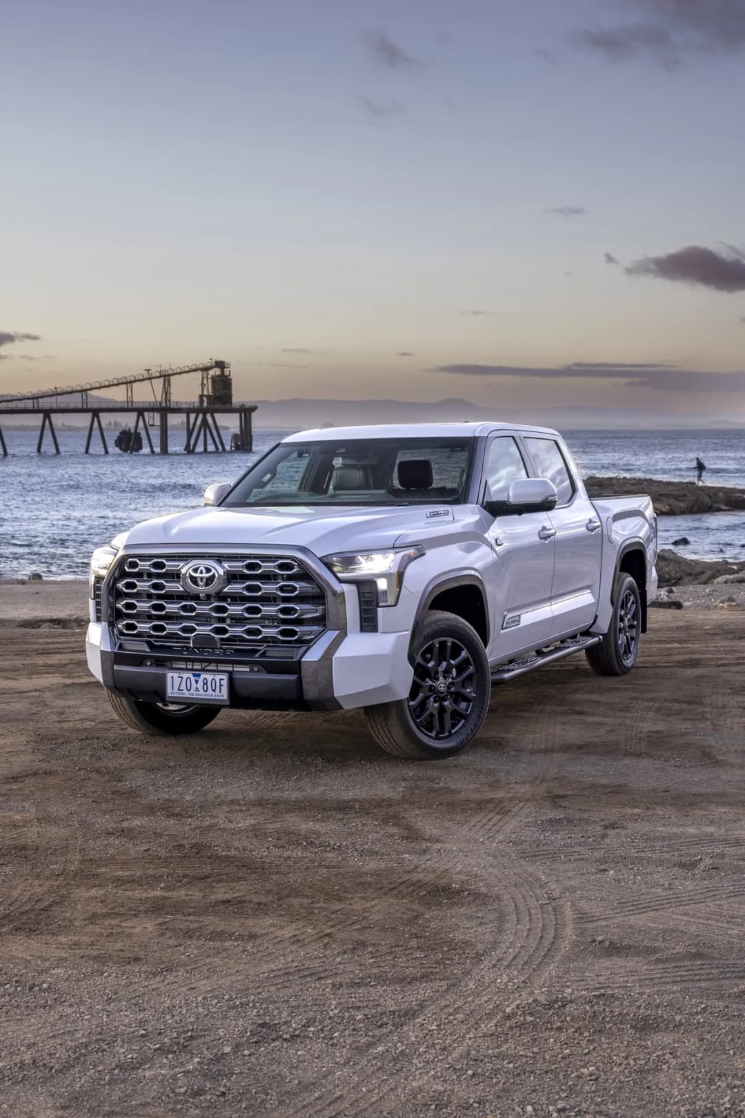 2025 Toyota Tundra Platinum, front three-quarter view by a coastal jetty