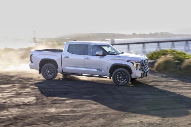 2025 Toyota Tundra Platinum side profile on a beach track