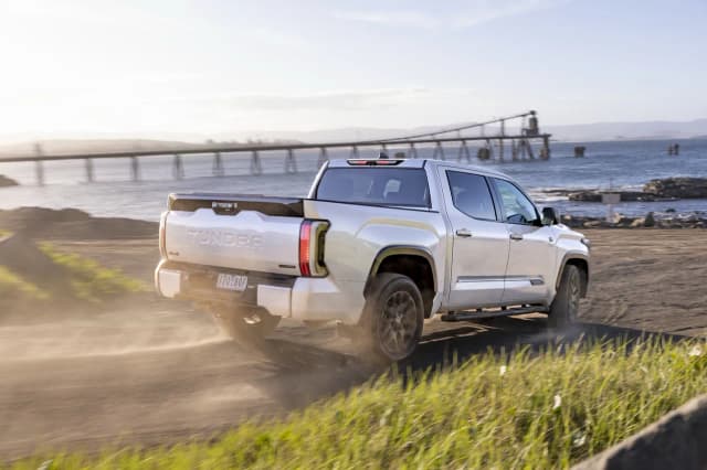 2025 Toyota Tundra Platinum driving on a sandy coastal track
