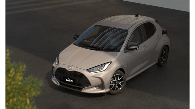 Toyota Yaris hatch in champagne, front three-quarter view from above