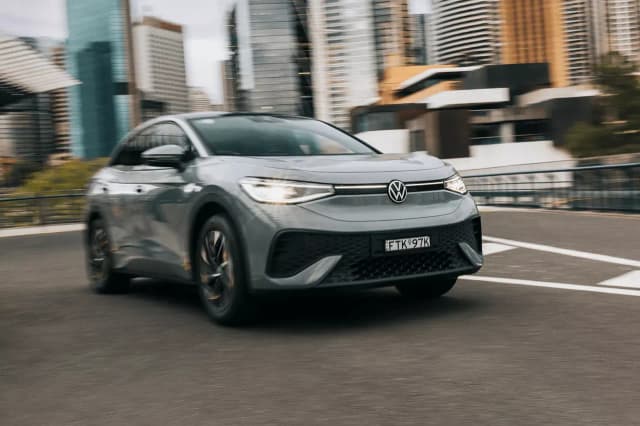 Grey Volkswagen ID.5 driving in the city, front view