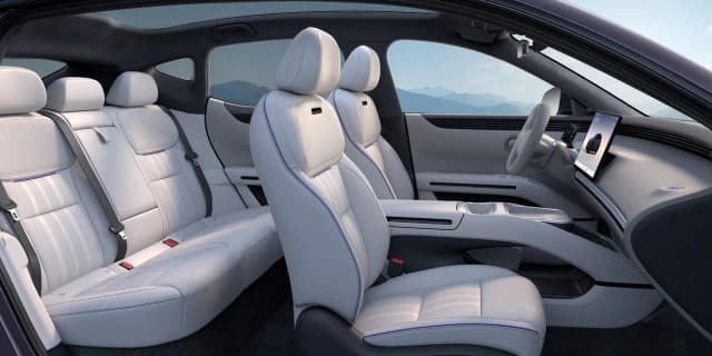 XPeng L03 front and rear seats in light grey trim with the doors open