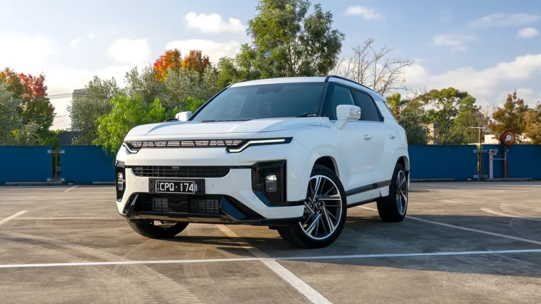 KGM Actyon SUV in white, front three-quarter view in a car park