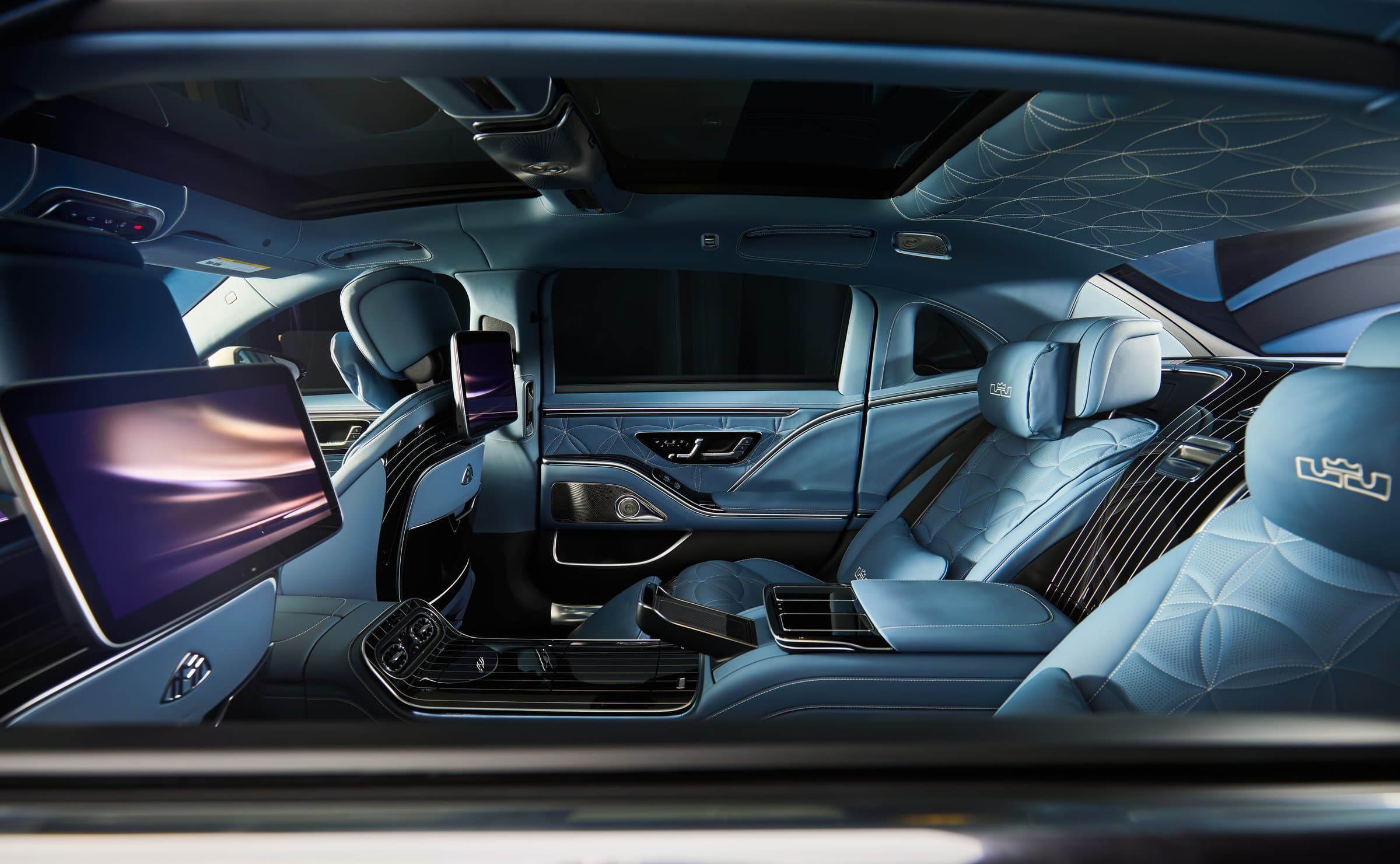 The full rear cabin with screens and quilted leather